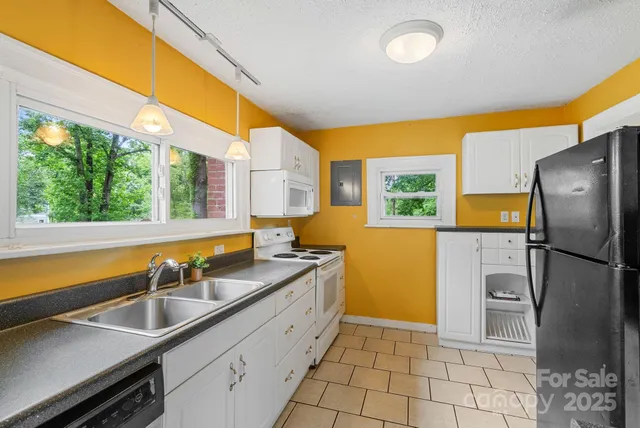 a kitchen with a sink and a refrigerator