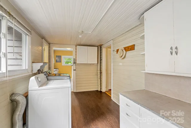 a kitchen that has a sink and a refrigerator