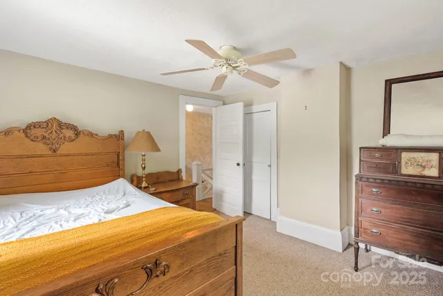 a bedroom with a bed and dresser