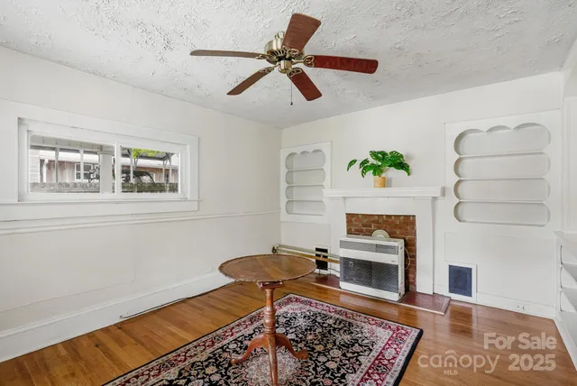 a living room with a couch and a rug