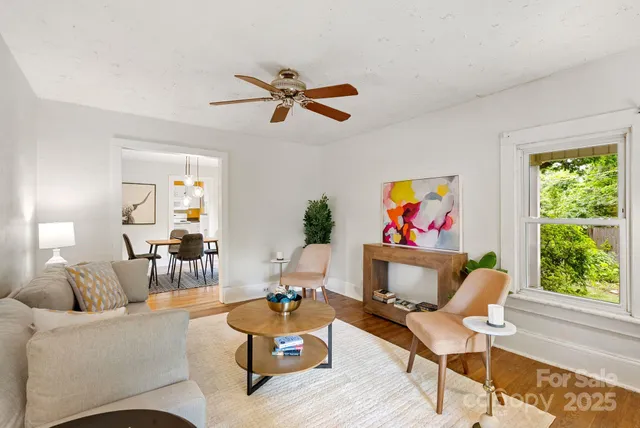 a living room with furniture and a window