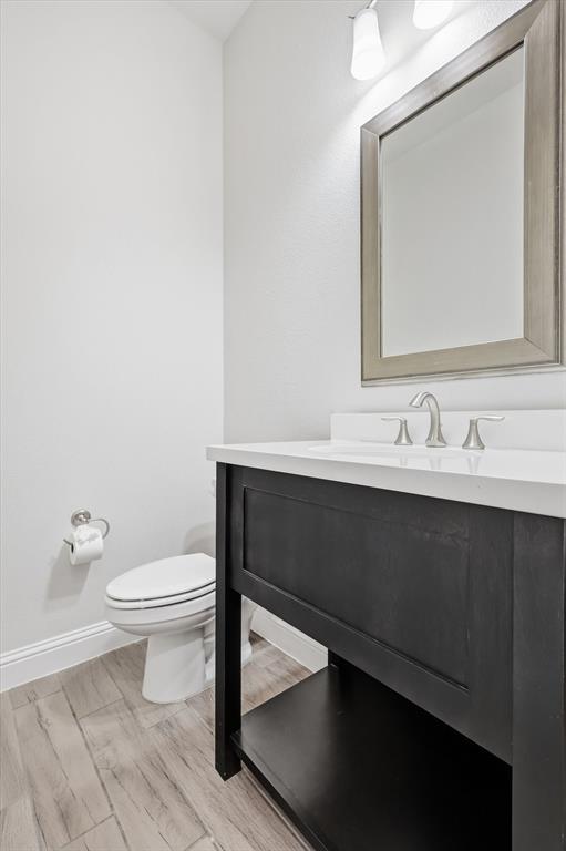 3968 Sevilla Drive Frisco, TX 75034 - Photo 12 of 38 a bathroom with a sink a toilet and mirror