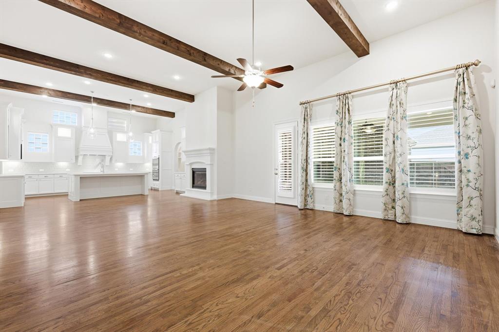 3968 Sevilla Drive Frisco, TX 75034 - Photo 14 of 38 a view of an empty room with wooden floor and a window