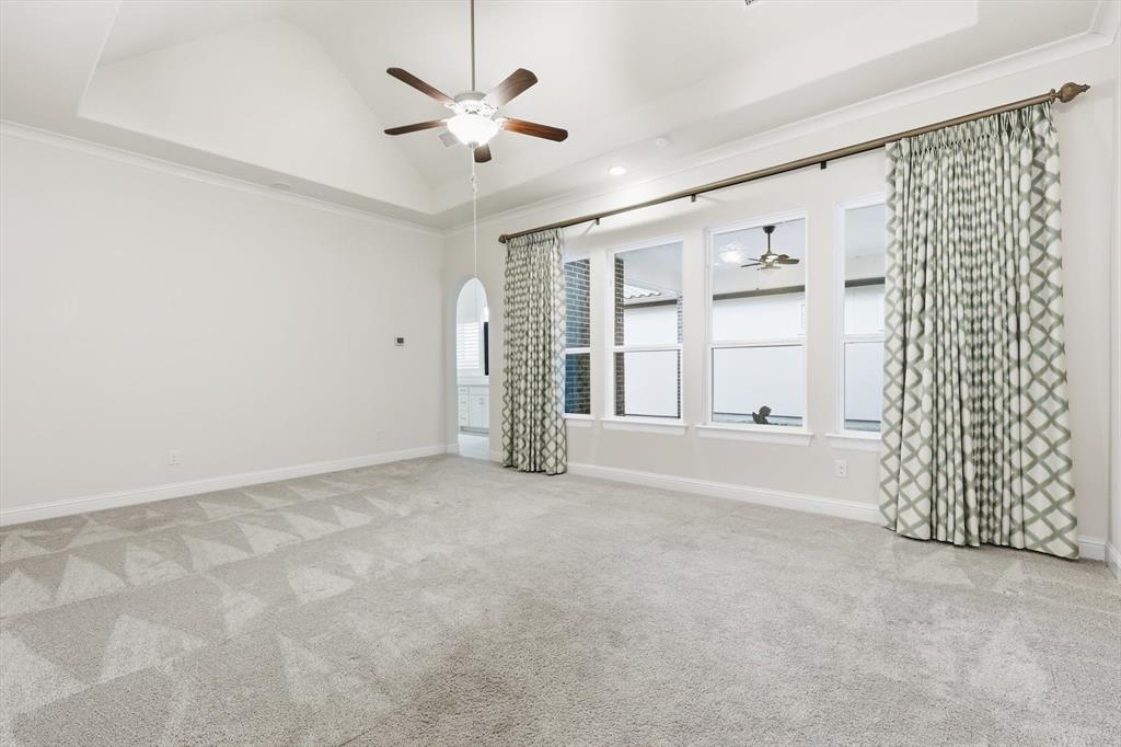 3968 Sevilla Drive Frisco, TX 75034 - Photo 22 of 38 an empty room with windows and ceiling fan