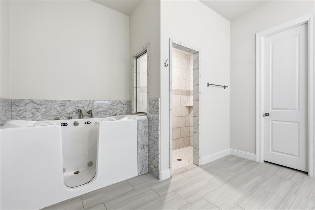 3968 Sevilla Drive Frisco, TX 75034 - Photo 24 of 38 an entryway with cabinet and mirror