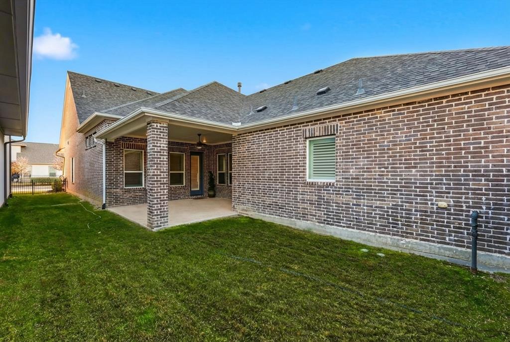 3968 Sevilla Drive Frisco, TX 75034 - Photo 30 of 38 a front view of a house with a yard