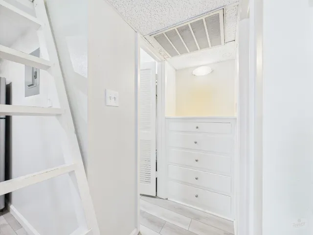 a view of a hallway with staircase