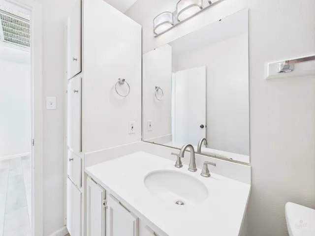 a living room with furniture and white walls