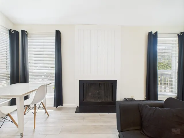 a kitchen with stainless steel appliances white cabinets and a sink