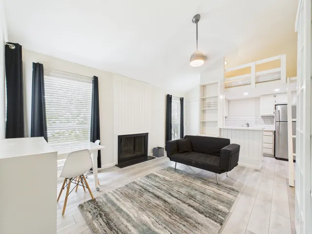 a living room with furniture and a table
