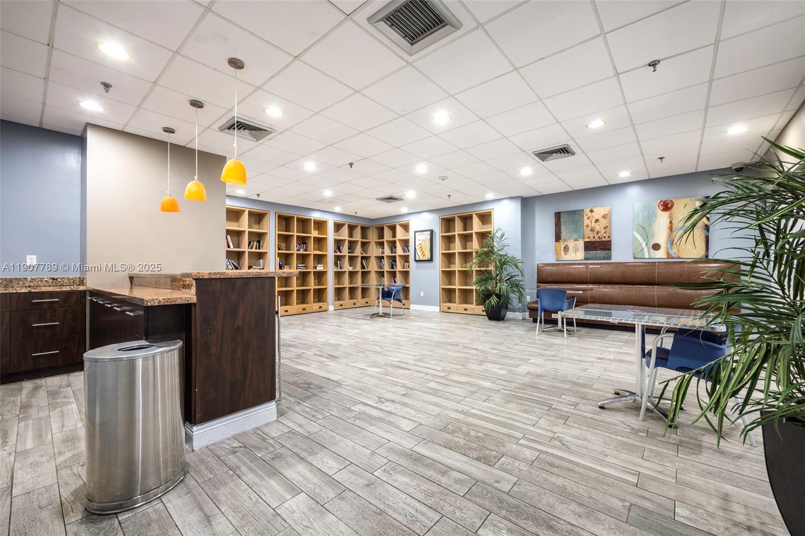 850 North Miami Avenue, Unit W906 Miami, FL 33136 - Photo 17 of 23 a living room with furniture a dining table and chairs with wooden floor