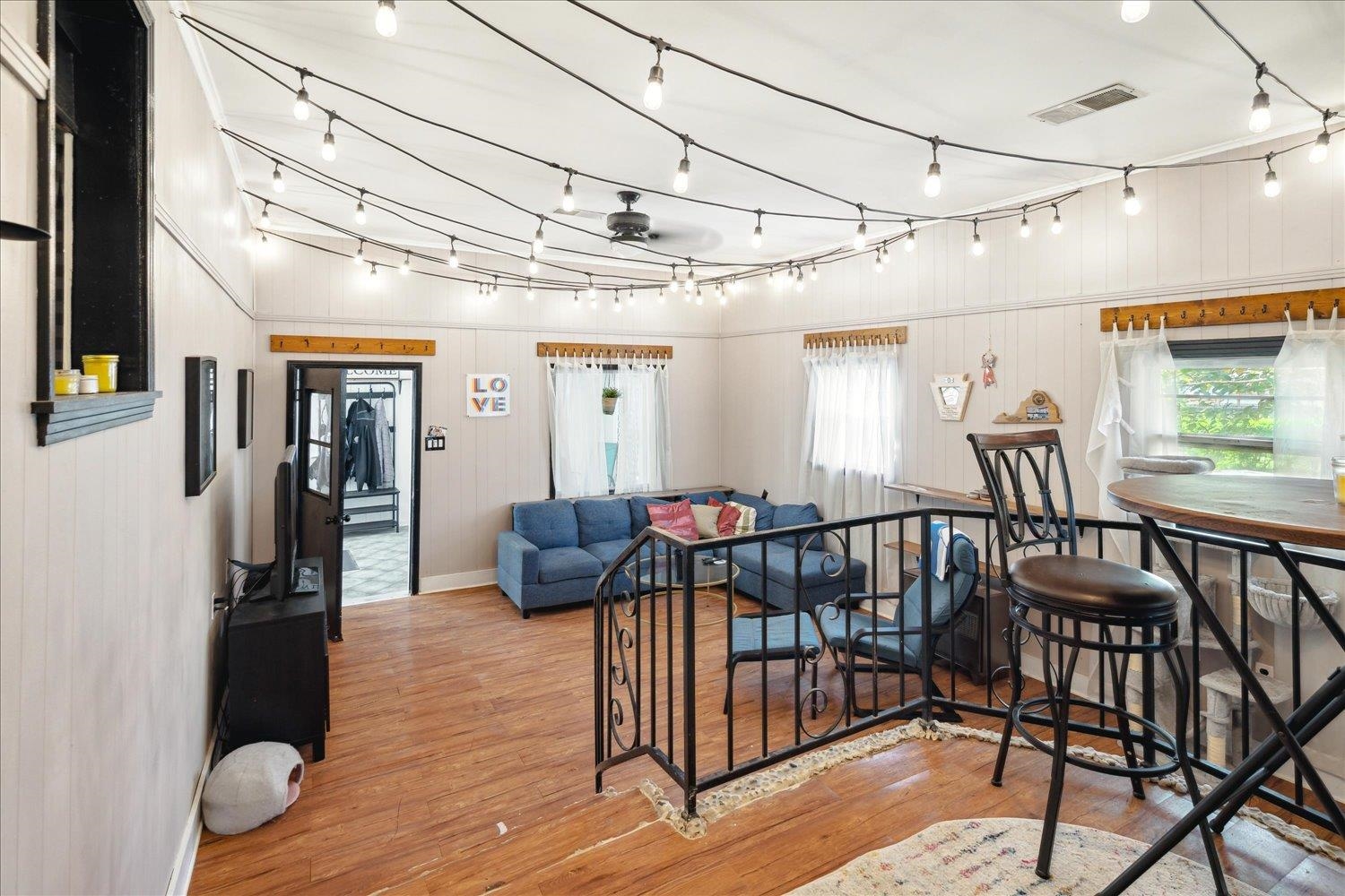 977 Waring Road Memphis, TN 38122 - Photo 14 of 32 Living room featuring hardwood / wood-style floors and wooden walls