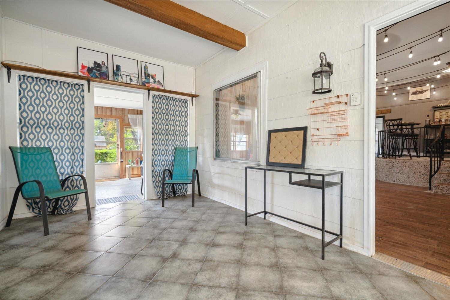 977 Waring Road Memphis, TN 38122 - Photo 19 of 32 Sitting room featuring beamed ceiling and rail lighting