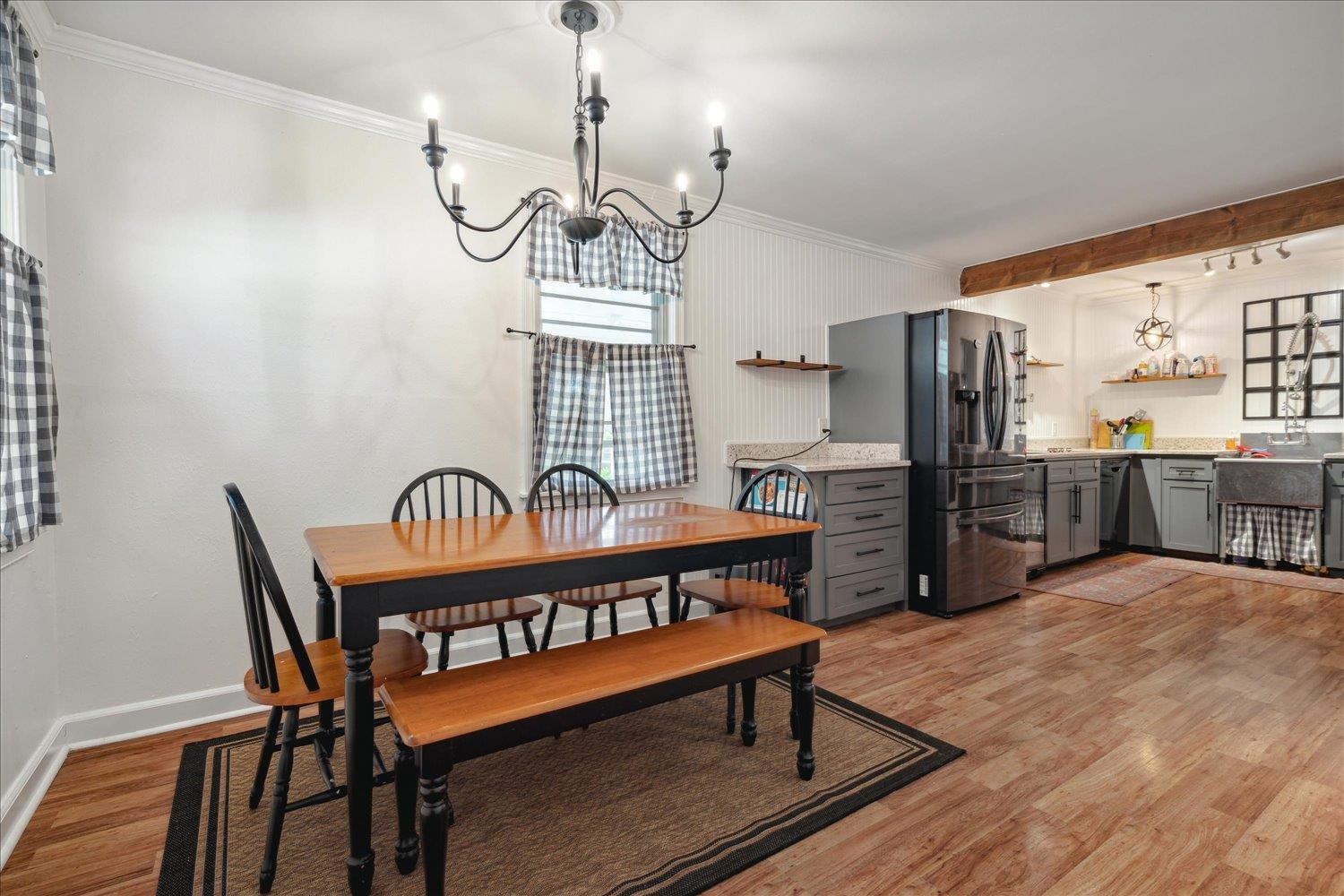 977 Waring Road Memphis, TN 38122 - Photo 6 of 32 Dining area with light hardwood / wood-style floors, crown molding, and a chandelier