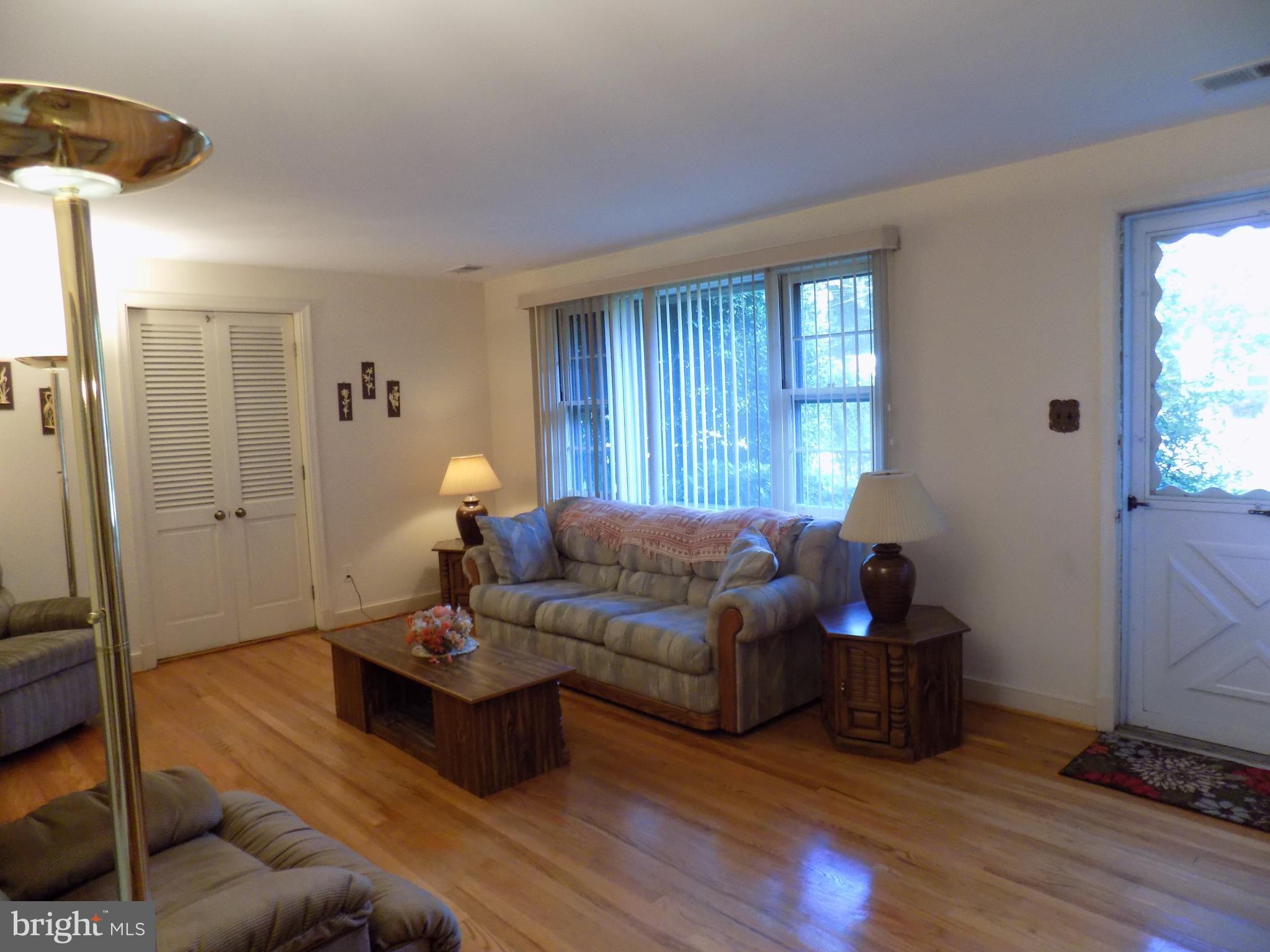 9603 Atom Road Clinton, MD 20735 - Photo 16 of 30 Large Living Room w/Refinished Hardwood Floors