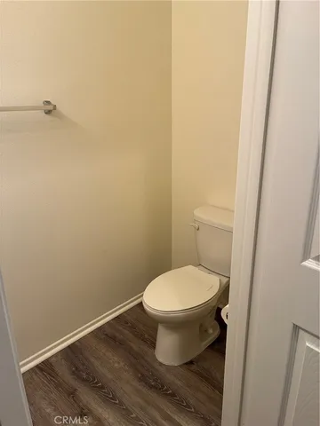 a white toilet sitting in a bathroom