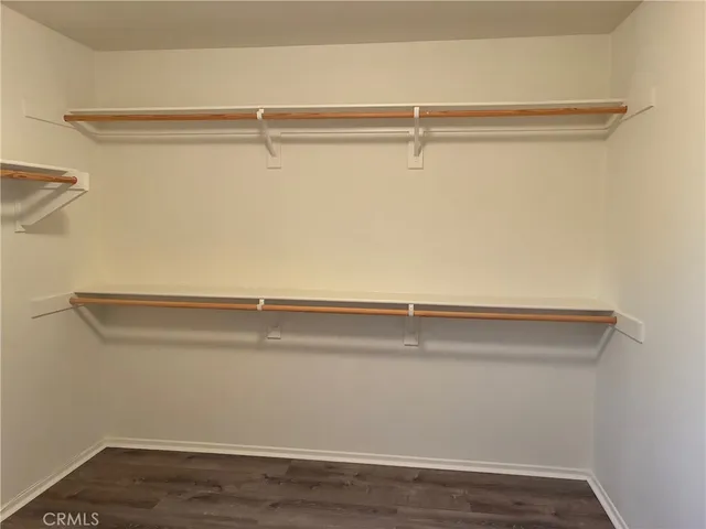 a white toilet sitting next to a sink