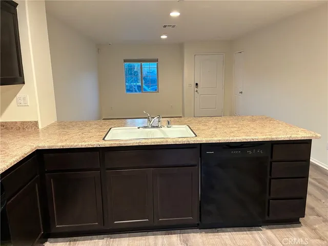 a bathroom with a sink vanity and mirror