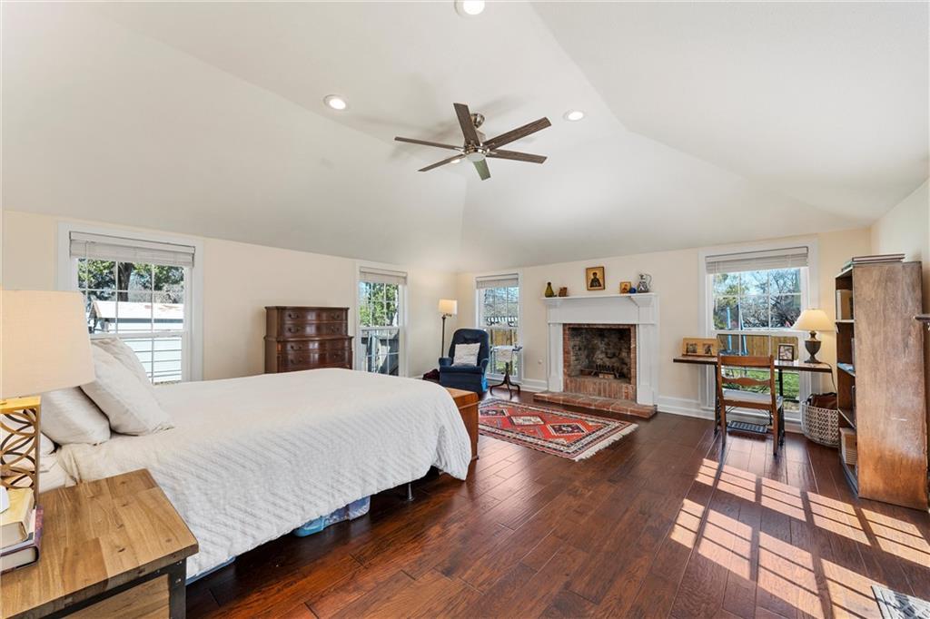 2737 Cumberland Avenue Waco, TX 76708 - Photo 24 of 45 a spacious bedroom with a bed and a fireplace