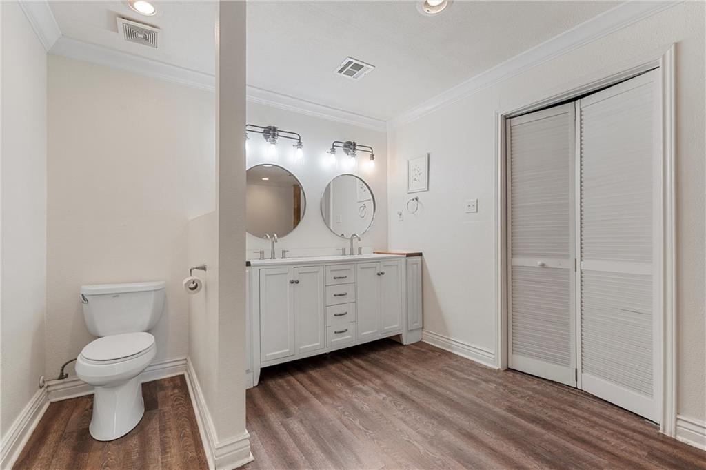 2737 Cumberland Avenue Waco, TX 76708 - Photo 27 of 45 a bathroom with a toilet sink and mirror