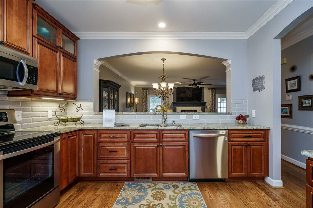 772 Weathergreen Drive Raleigh, NC 27615 - Photo 6 of 26 Open to dining area. Beveled subway tile. Kitchen