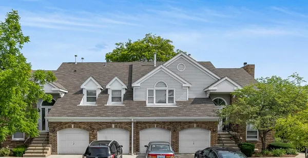 a aerial view of a house with a yard