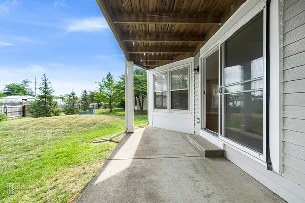 a view of a porch with a backyard