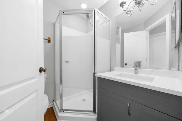 a bathroom with a sink a mirror and a bathtub