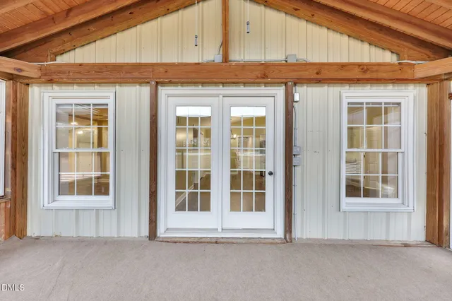 a view of an empty room with a large window