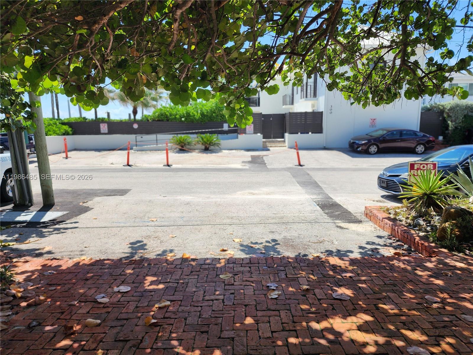 315 Walnut Street, Unit 2 Hollywood, FL 33019 - Photo 22 of 23 a view of a yard with plants and trees