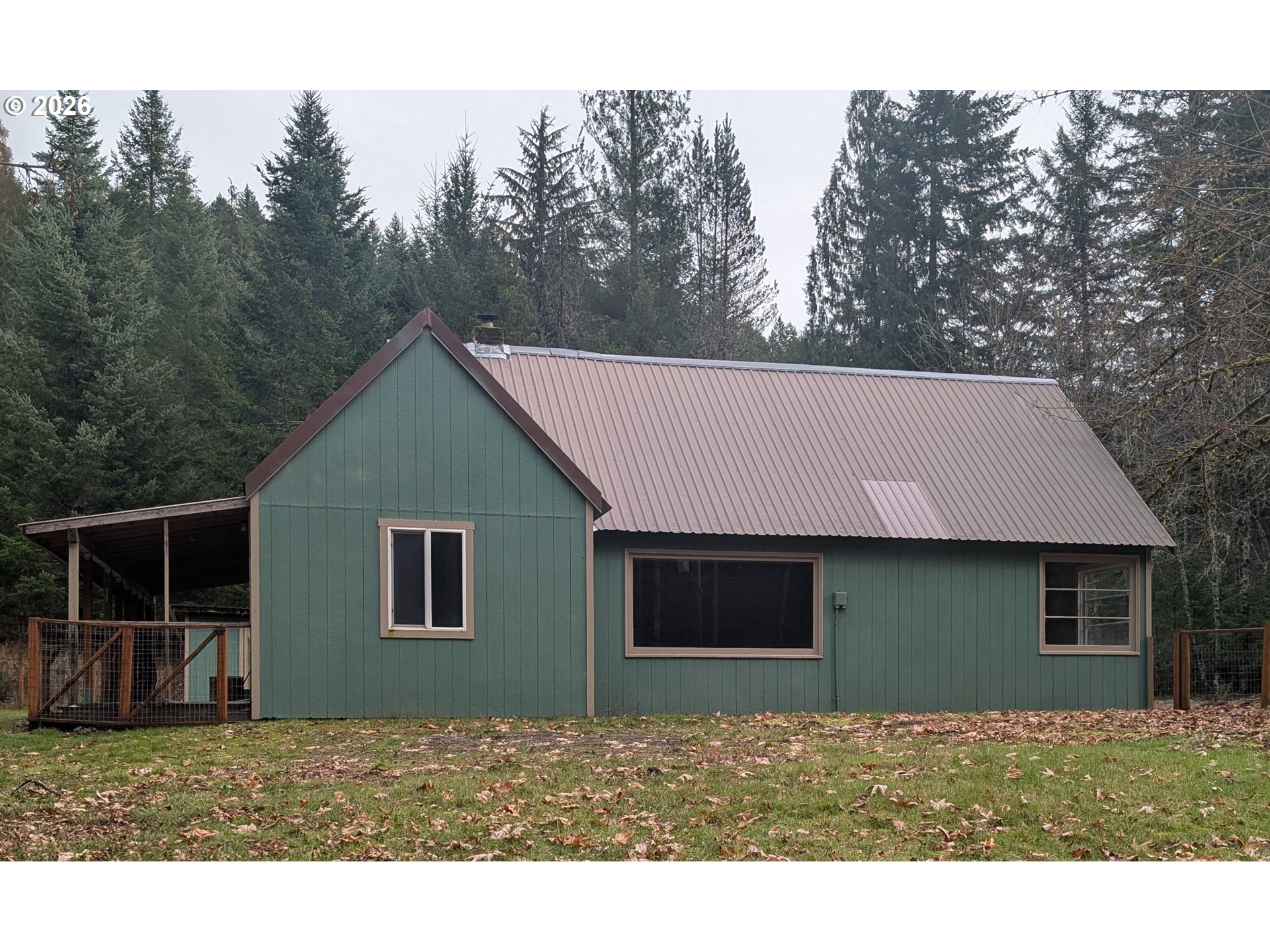 8892 Wind River Highway Carson, WA 98610 - Photo 1 of 7 a view of a house with a backyard