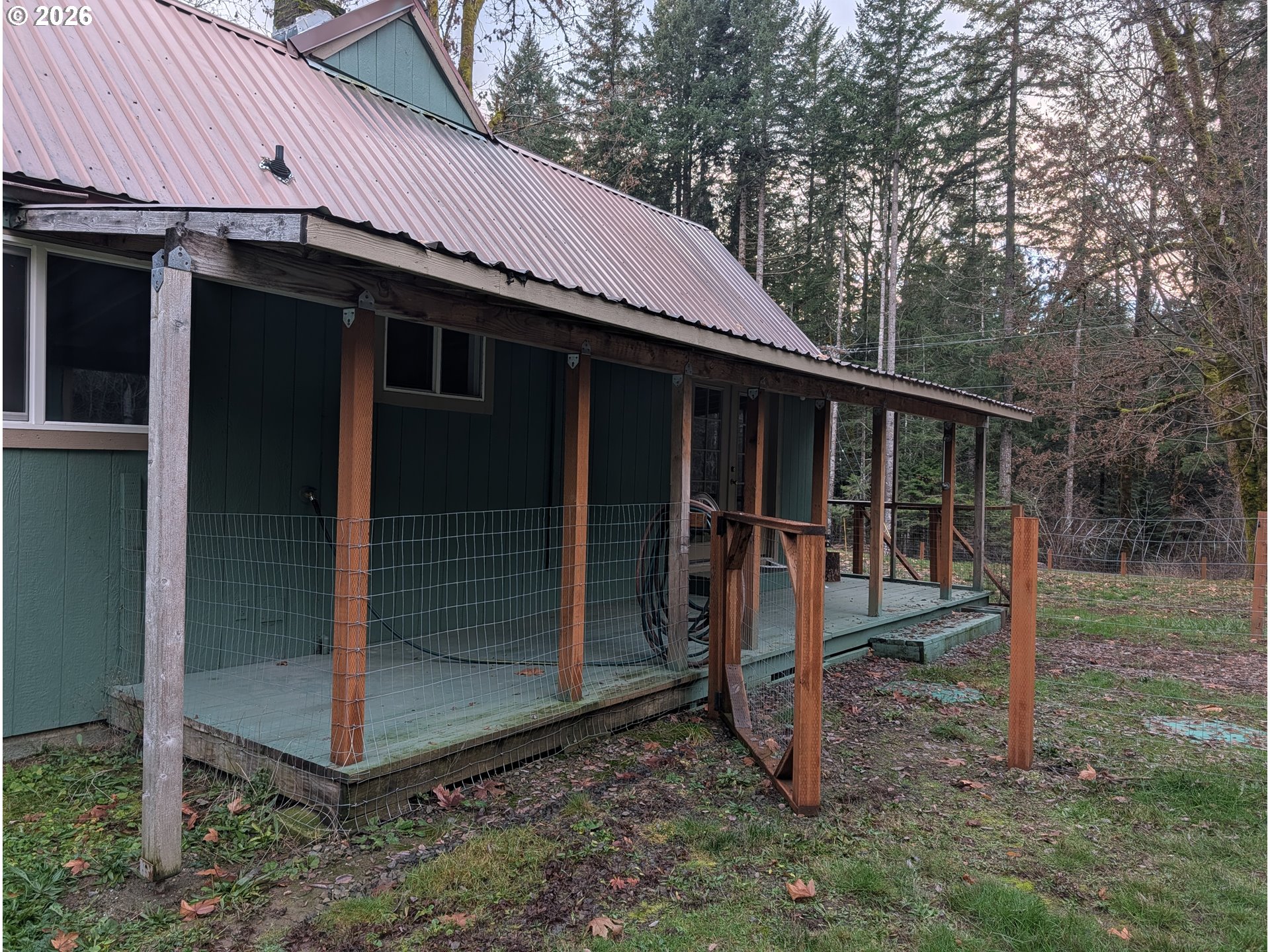 8892 Wind River Highway Carson, WA 98610 - Photo 3 of 7 a view of a house with backyard
