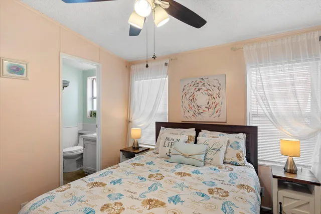 a bedroom with a bed and a lamp