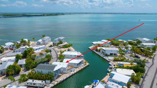 a bird view of house with outdoor space and seating