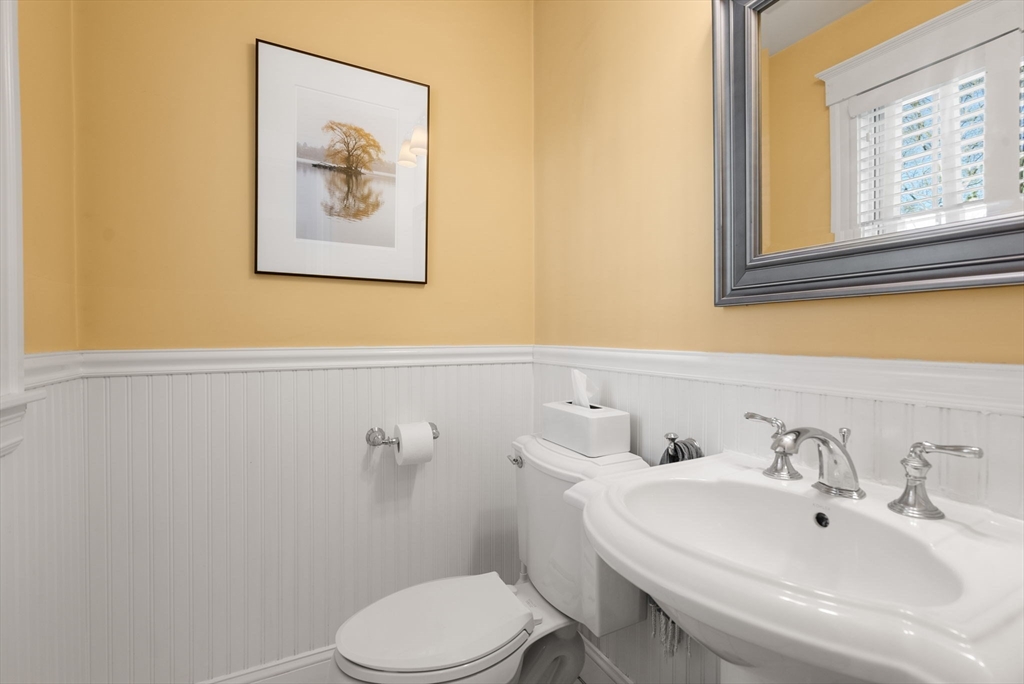 241 Weston Road Wellesley, MA 02482 - Photo 13 of 27 a bathroom with a sink mirror and toilet