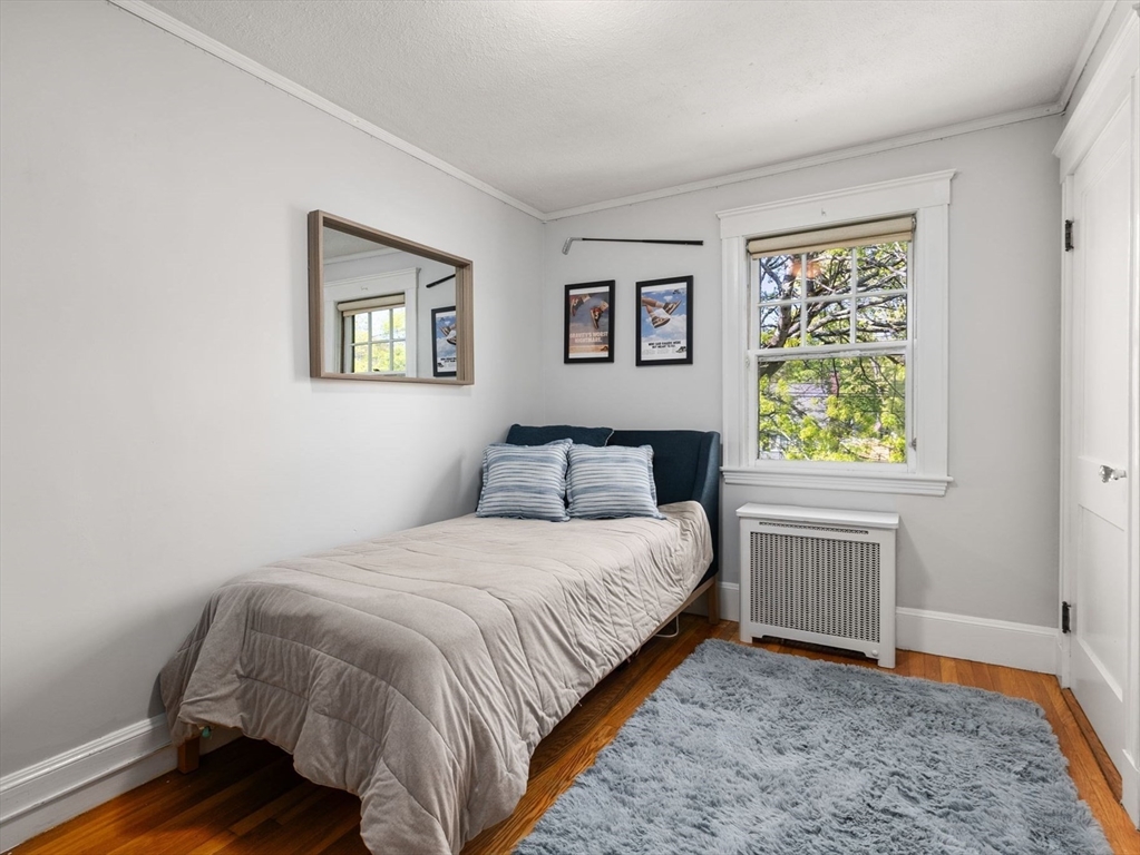 241 Weston Road Wellesley, MA 02482 - Photo 16 of 27 a bedroom with a bed and a window