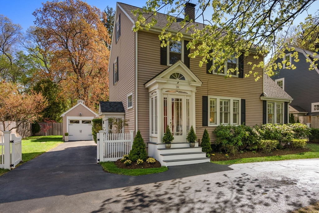 241 Weston Road Wellesley, MA 02482 - Photo 2 of 27 a front view of a house with a yard