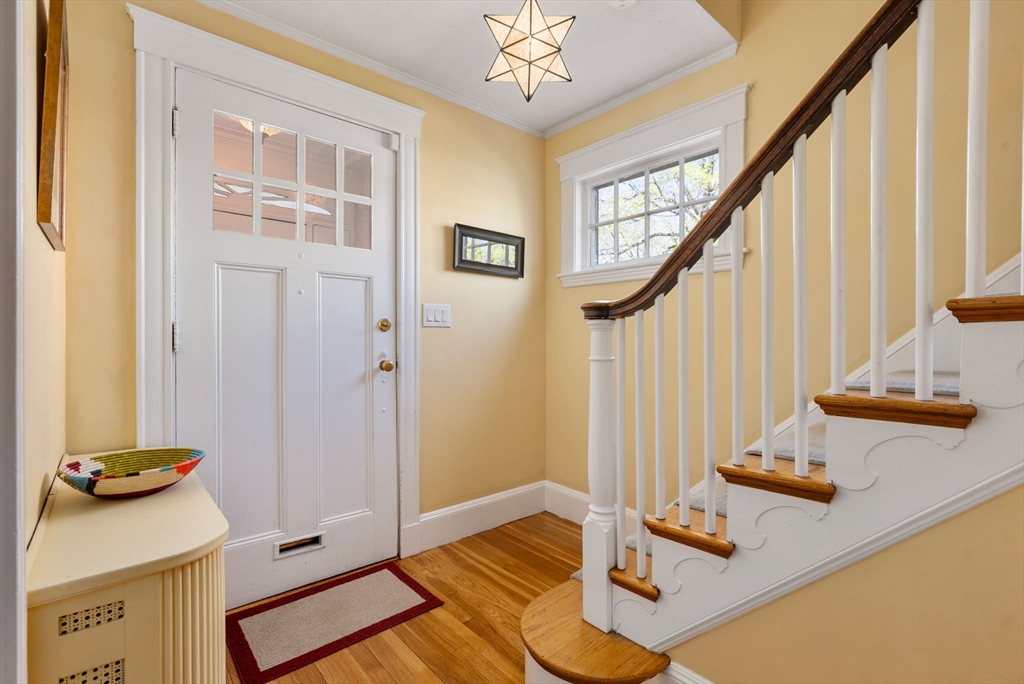 241 Weston Road Wellesley, MA 02482 - Photo 3 of 27 a view of an entryway with wooden floor and staircase