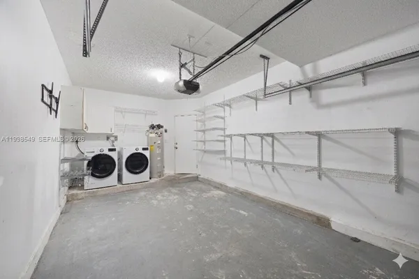 a view of a storage & utility room with washer and dryer