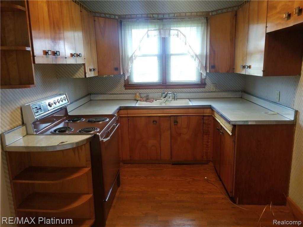 10091 Fenton Road Fenton, MI 48430 - Photo 13 of 13 Charming kitchen with window overlooking front yard, hardwood floors