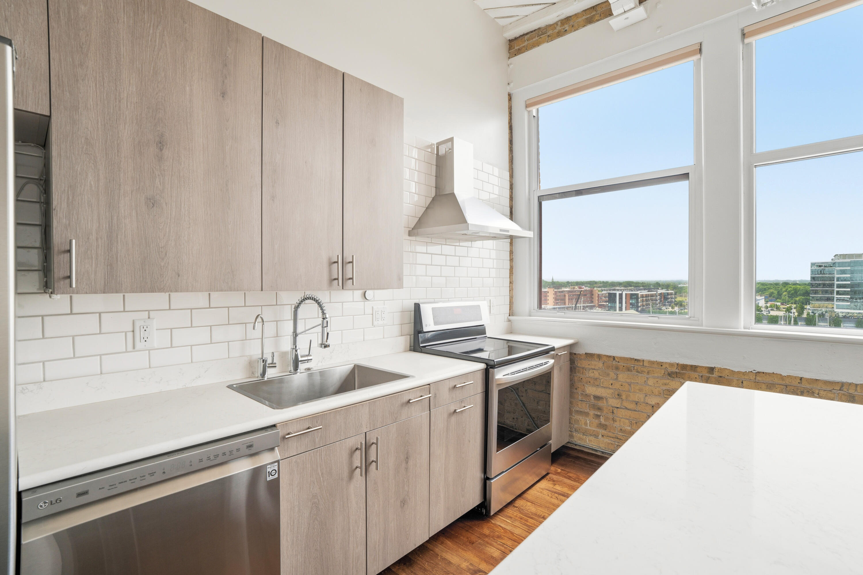 215 West Maple Street, Unit 607 Milwaukee, WI 53204 - Photo 7 of 20 Newer Appliances, Quartz Counters, and Subway Backsplash.