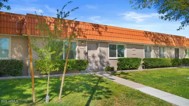 a front view of a house with a yard