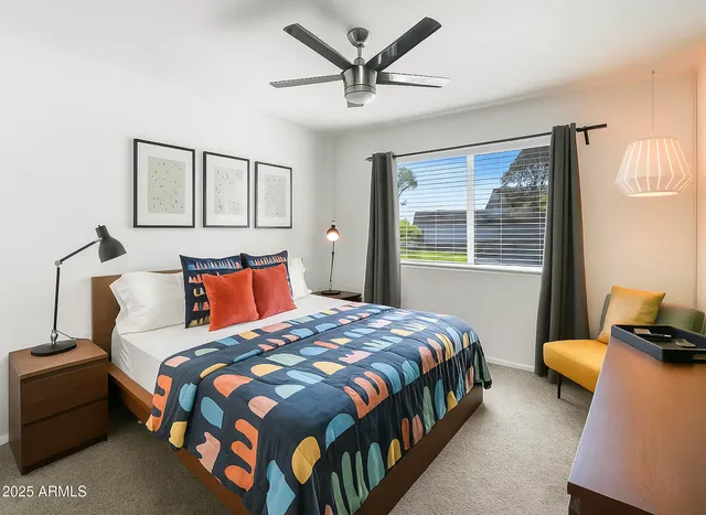 a bedroom with bed and a window