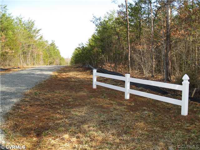 6 Three Three Chopt Road Gum Spring, VA 23065 - Photo 2 of 2 a view of backyard with wooden fence