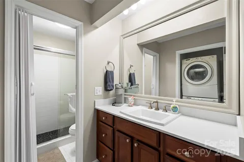 a close view of a utility room with dryer and washer
