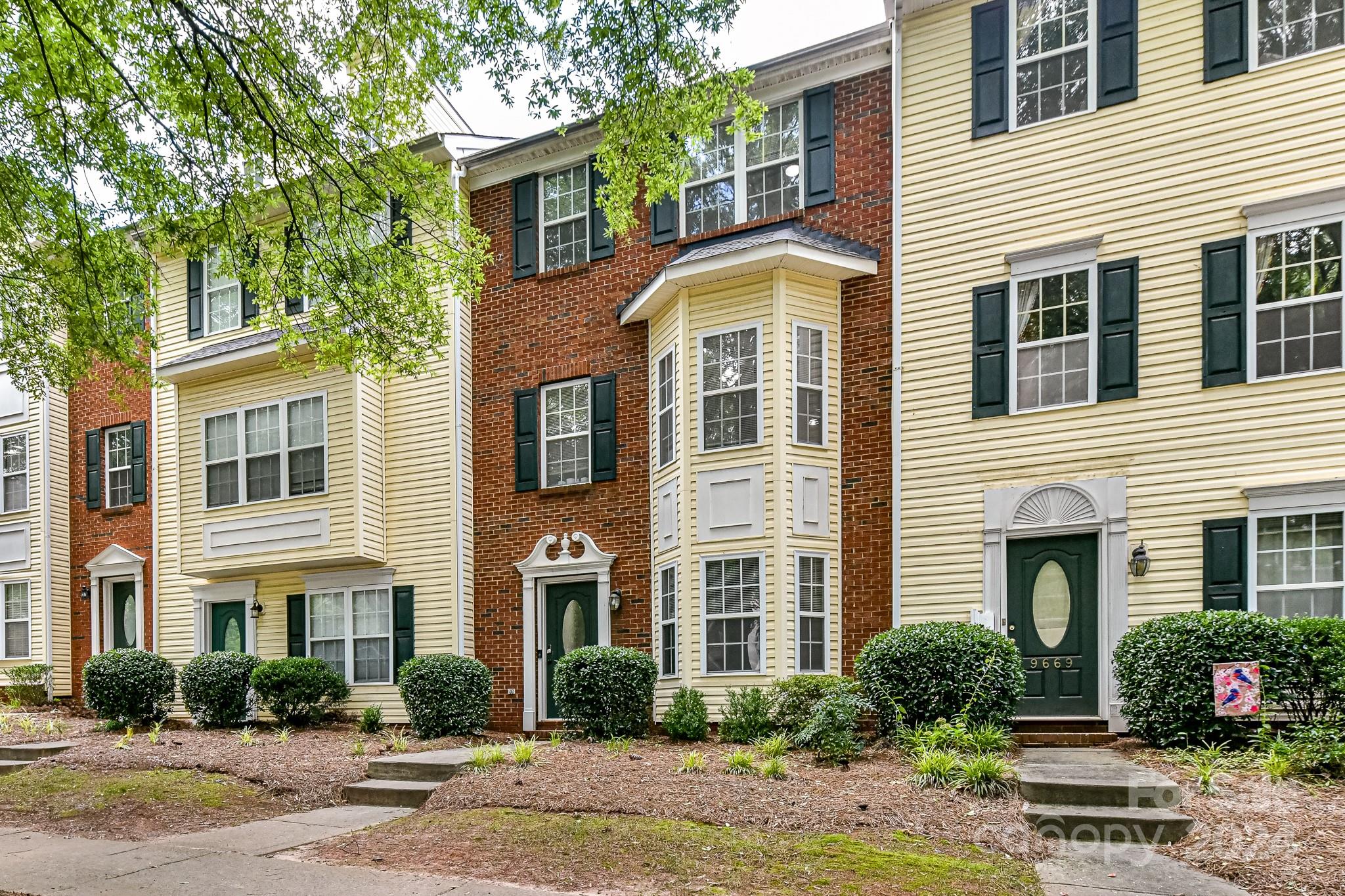 9665 Bailey Road Cornelius, NC 28031 - Photo 1 of 31 a front view of a residential houses with yard