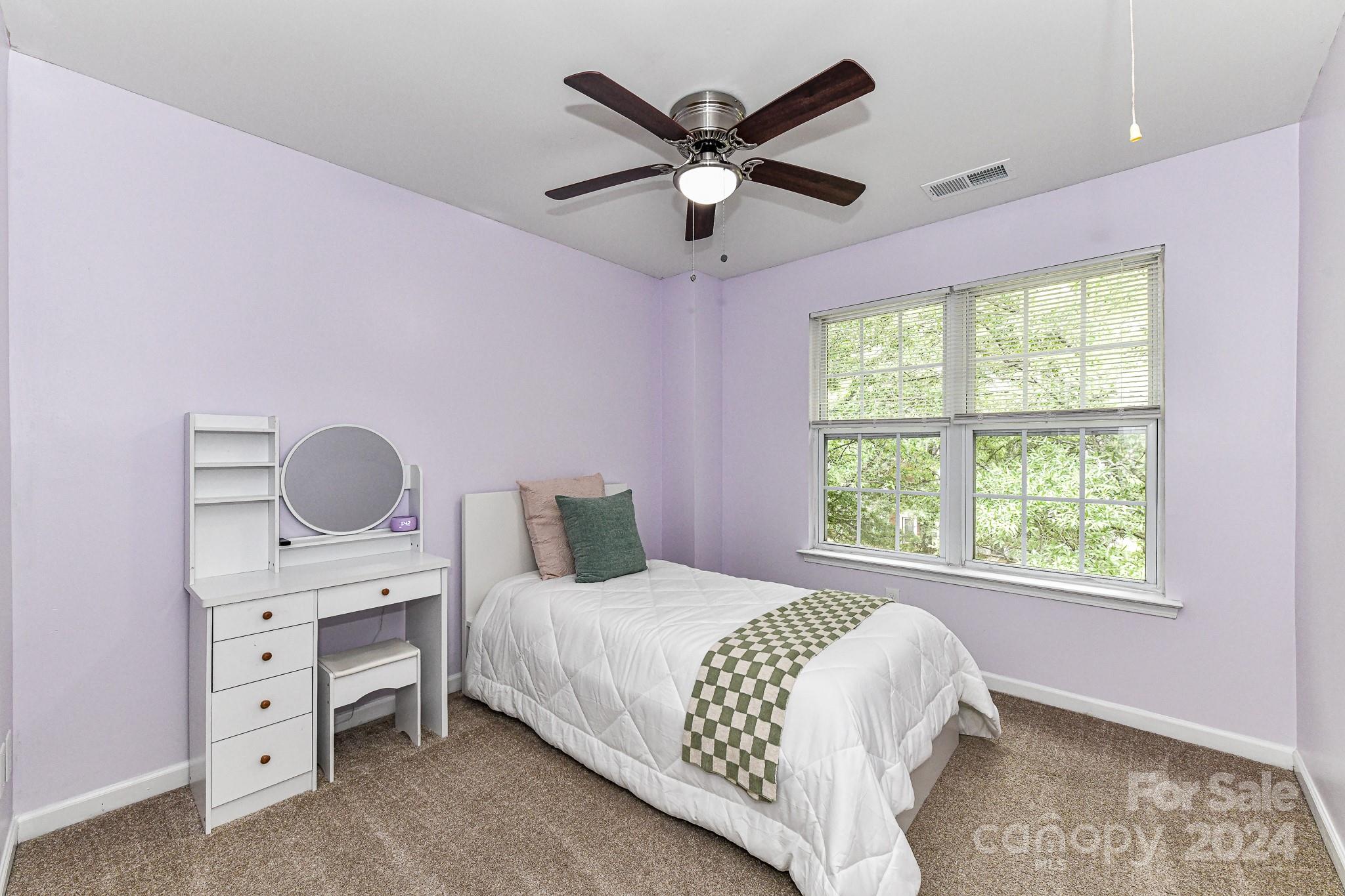 9665 Bailey Road Cornelius, NC 28031 - Photo 20 of 31 a bedroom with a bed and a window