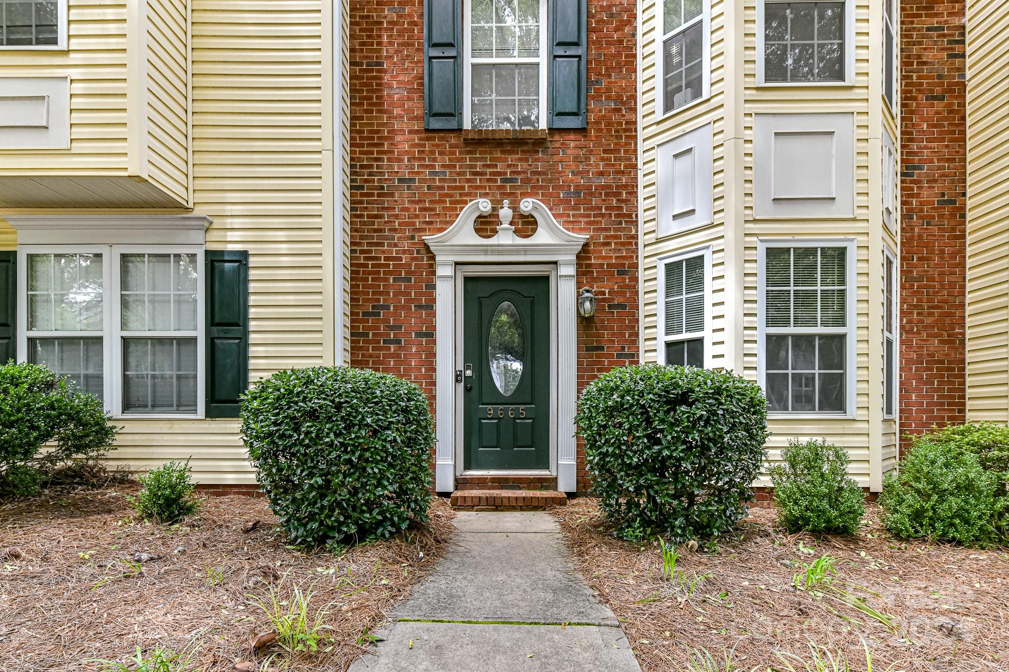 9665 Bailey Road Cornelius, NC 28031 - Photo 2 of 31 a front view of a house with garden