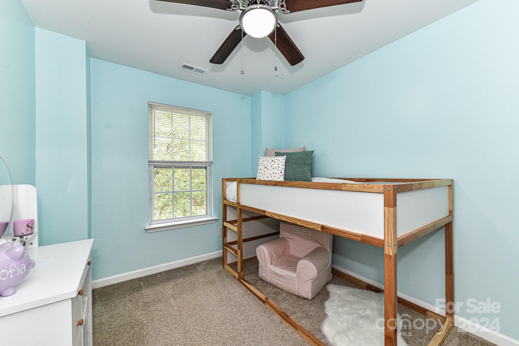 9665 Bailey Road Cornelius, NC 28031 - Photo 23 of 31 a bedroom with furniture and window