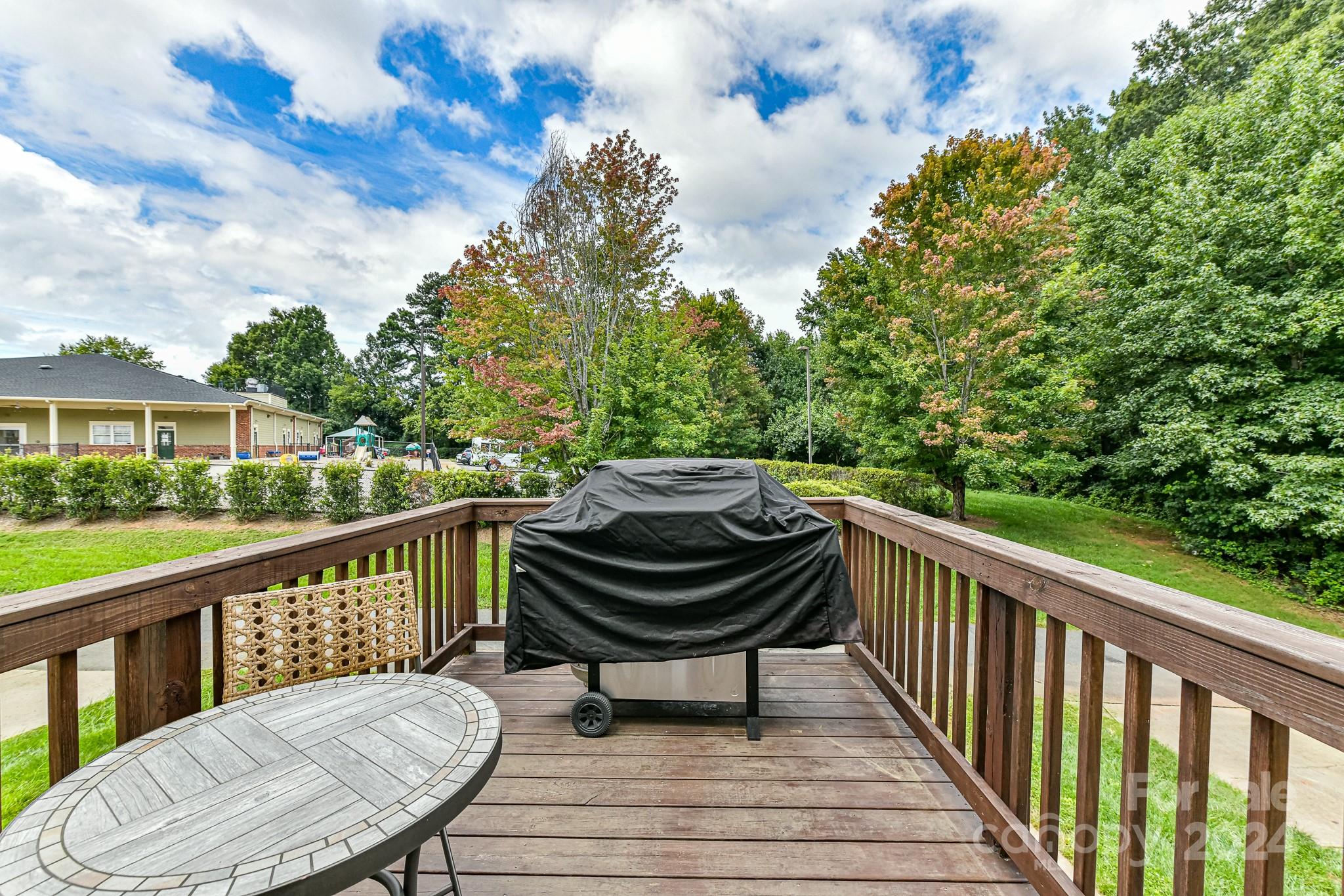 9665 Bailey Road Cornelius, NC 28031 - Photo 26 of 31 a view of a chair and tables on the balcony